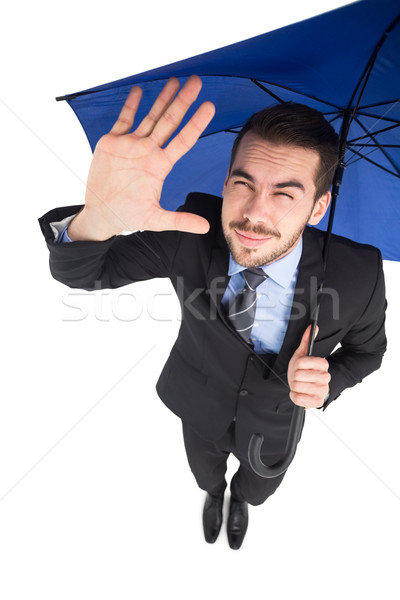 Blinded businessman protecting his eyes with his hand Stock photo © wavebreak_media