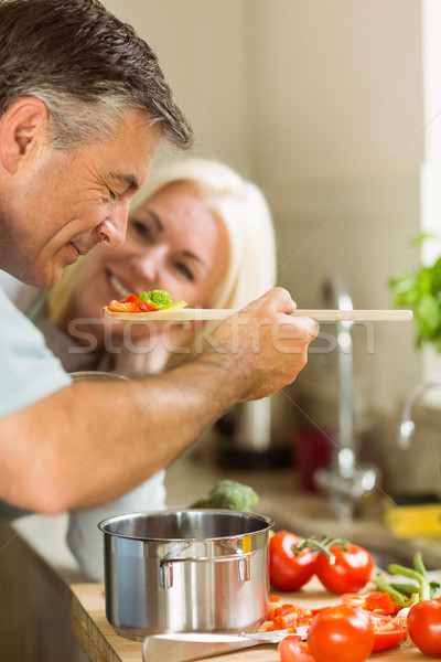 Stock photo: Mature couple preparing vegetarian meal together