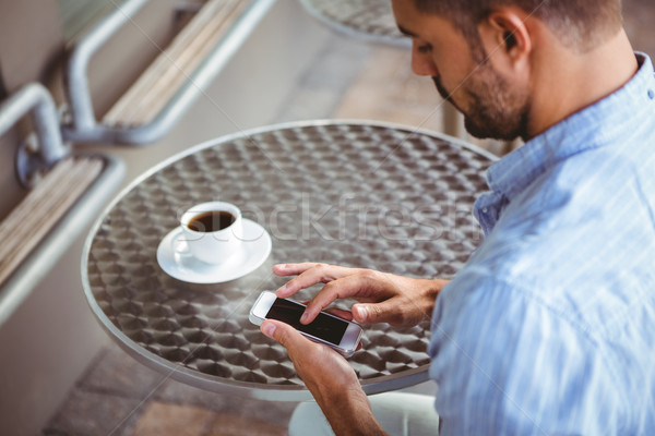 Attentive businessman sending text message Stock photo © wavebreak_media