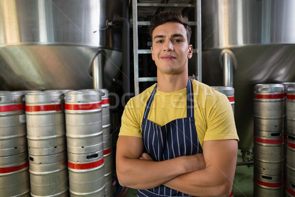 Portrait of smiling worker standing by storage tanks Stock photo © wavebreak_media