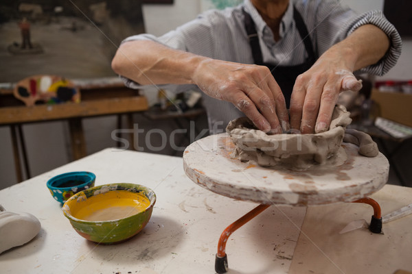 Mid-section of senior man molding clay Stock photo © wavebreak_media