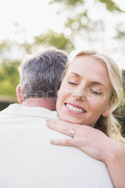 Cute couple à l'extérieur femme herbe [[stock_photo]] © wavebreak_media