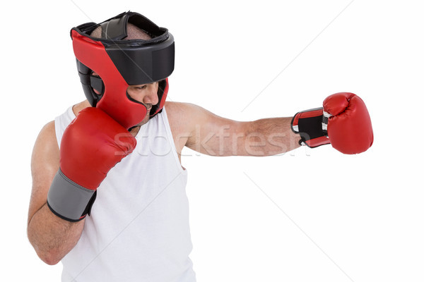 Stock photo: Boxer wearing head protector and gloves