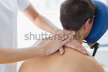 Naked woman receiving back massage Stock photo © wavebreak_media