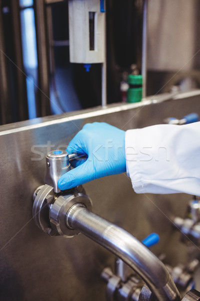 Stock photo: Manufacturer holding pipe at distillery