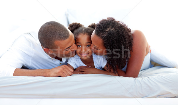 Derűs szülők csók lánygyermek család lány Stock fotó © wavebreak_media