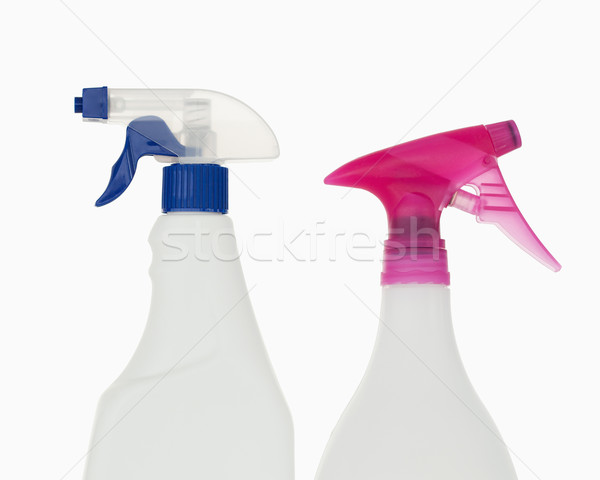 Close up of  pink and  blue spray bottles against a white background Stock photo © wavebreak_media