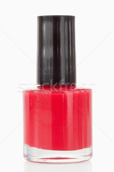 Stock photo: Red nail polish against a white background