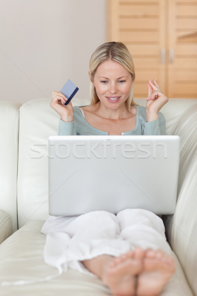 Young woman about to win an online auction Stock photo © wavebreak_media