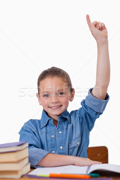 Stock photo: Portrait of a girl raising her arms against a white background