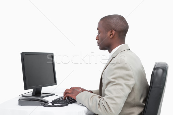 Businessman using a monitor against a white background Stock photo © wavebreak_media