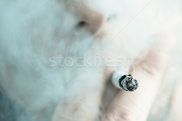 Homme fumer sur cigarette fumée tête [[stock_photo]] © wavebreak_media