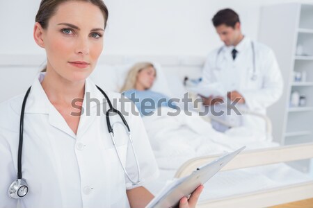 Patient and doctor together in an examination Stock photo © wavebreak_media