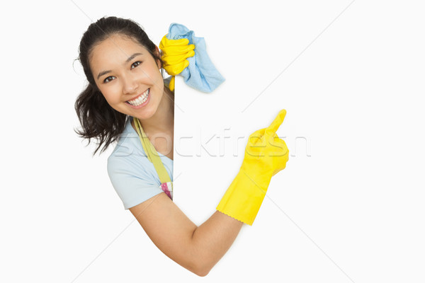Stockfoto: Vrouw · rubberen · handschoenen · schort · wijzend · witte · oppervlak