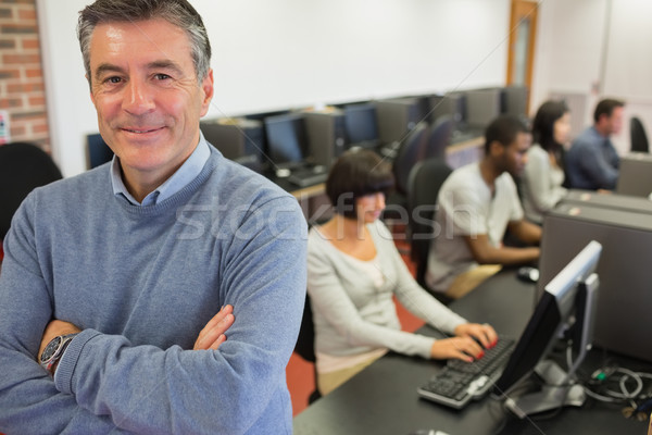 Enseignants souriant haut ordinateur classe collège [[stock_photo]] © wavebreak_media