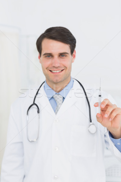 Jóképű férfi orvos tart injekció portré kórház Stock fotó © wavebreak_media