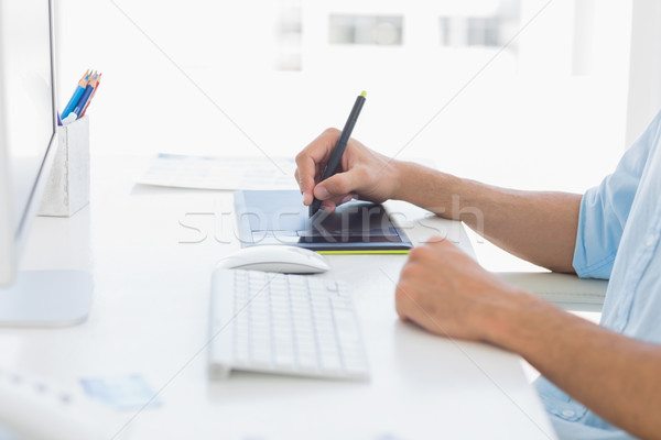 Mid section of a photo editor using graphics tablet Stock photo © wavebreak_media