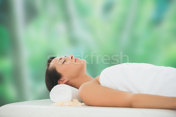 Stock photo: Beautiful brunette relaxing on massage table 