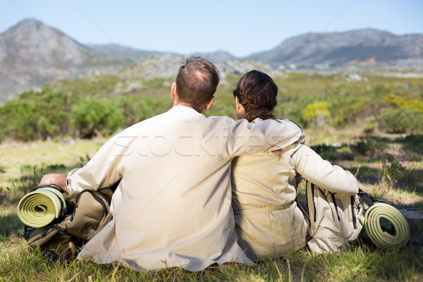 Hiking couple sitting and admiring the scenery Stock photo © wavebreak_media