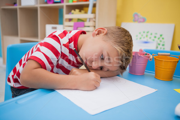 Cute little boy drawing at desk Stock photo © wavebreak_media