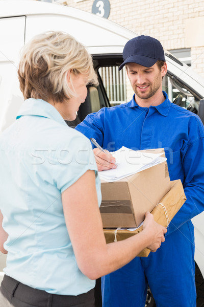  Happy delivery man with customer Stock photo © wavebreak_media