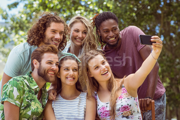 Stock photo: Happy friends taking a selfie