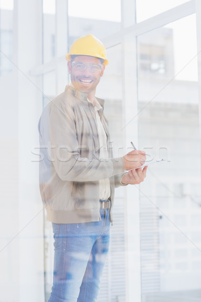 Architect writing on clipboard in office Stock photo © wavebreak_media