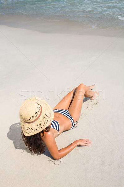 Stock photo: Rear view of pretty brunette looking at the ocean