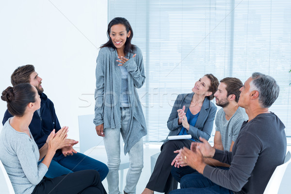  Rehab group applauding delighted woman standing up Stock photo © wavebreak_media