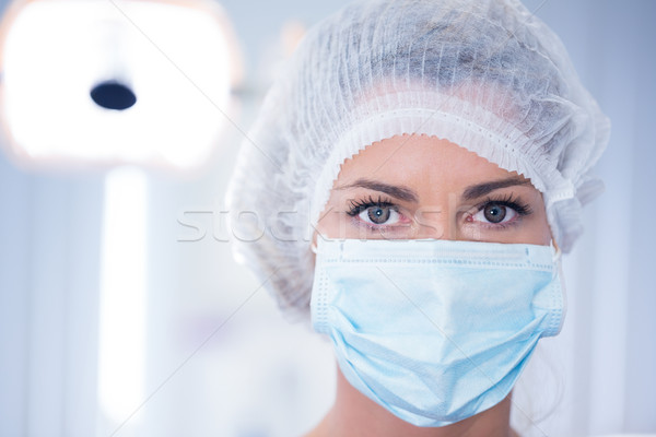 Foto stock: Dentista · mascarilla · quirúrgica · CAP · mirando · cámara · dentales