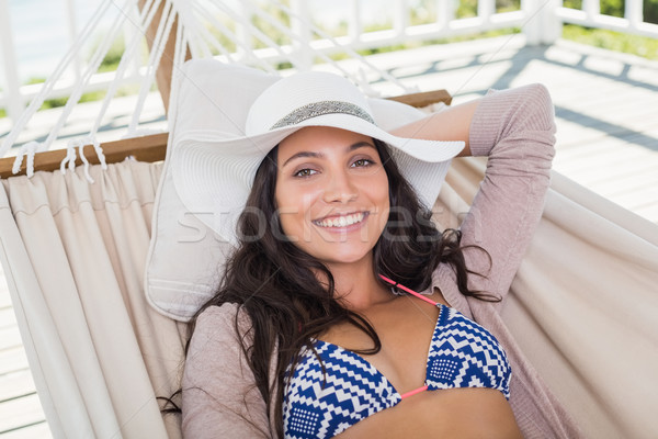 Pretty brunette relaxing on a hammock Stock photo © wavebreak_media