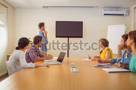 Stock photo: Attentive business team applausing after a conference