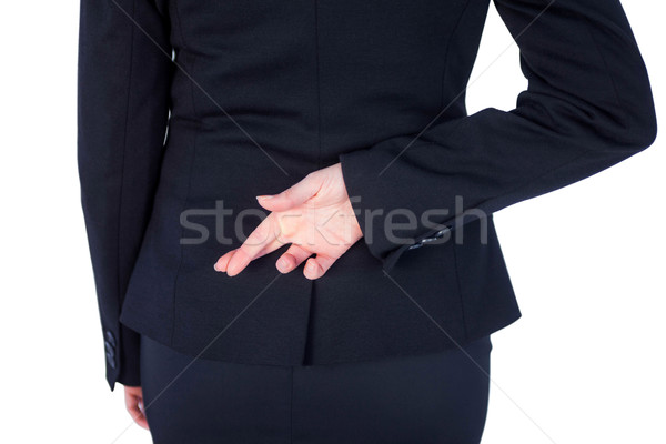 Close up pretty businesswoman with finger crossed  Stock photo © wavebreak_media