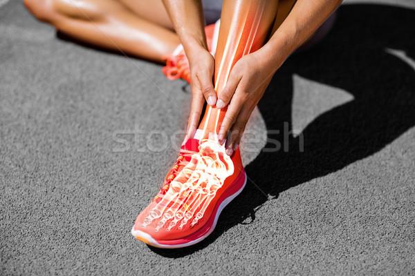 Low section of female athlete suffering from joint pain on track Stock photo © wavebreak_media