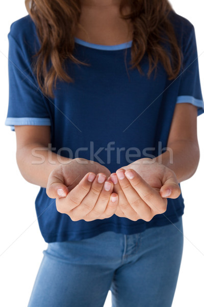 Girl with hand cupped against white background Stock photo © wavebreak_media