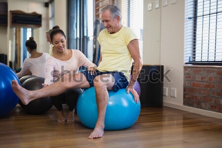 Physiotherapist giving physical therapy of leg to senior patient Stock photo © wavebreak_media