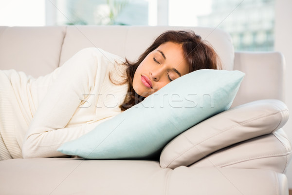 Beautiful brunette taking a nap lying on the couch Stock photo © wavebreak_media