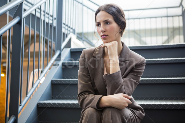 Jeunes femme d'affaires séance escalier fatigué bureau [[stock_photo]] © wavebreak_media