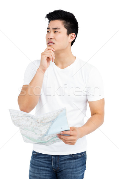 Jeune homme regarder carte blanche chinois Homme [[stock_photo]] © wavebreak_media