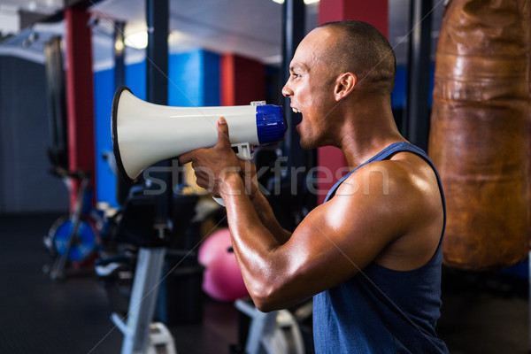 Férfi atléta kiált megafon oldalnézet fitnessz Stock fotó © wavebreak_media