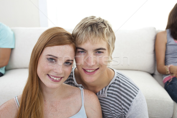 Stock photo: Cute couple smiling at the camera