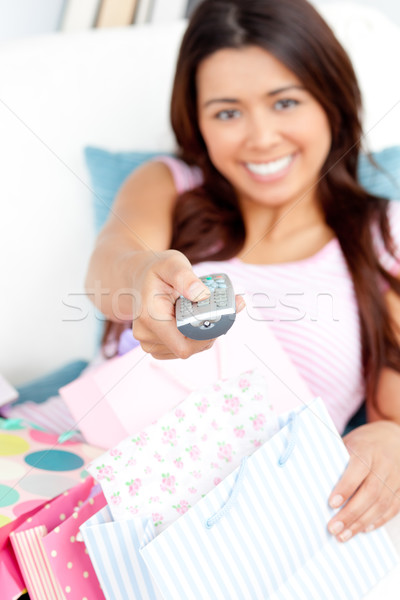 Simper woman watching TV on sofa Stock photo © wavebreak_media