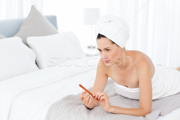 Attractive woman putting on Make up Stock photo © wavebreak_media