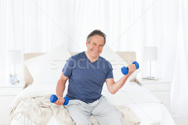 Senior do exercises at home Stock photo © wavebreak_media