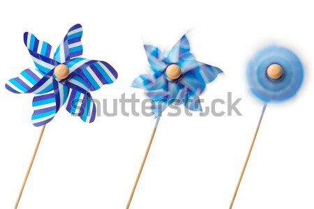 Pink and blue paper windmills on a white background Stock photo © wavebreak_media