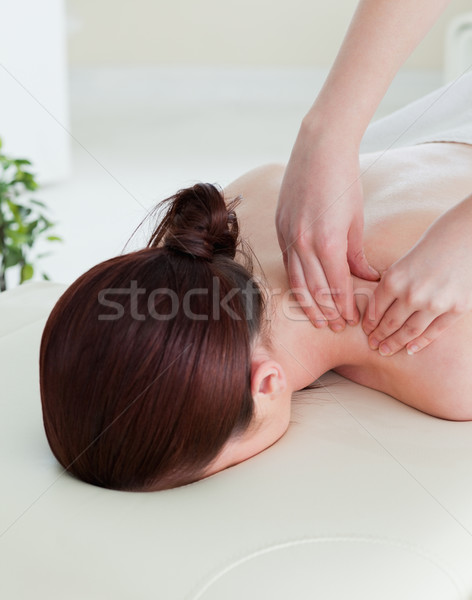 Stock photo: Portrait of a red-haired woman having a rolling massage