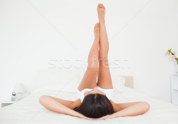 Gyönyörű nő lábak kiemelt felfelé magas karok Stock fotó © wavebreak_media