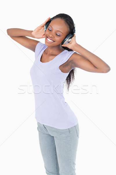 Femme souriante écouter de la musique casque blanche musique [[stock_photo]] © wavebreak_media