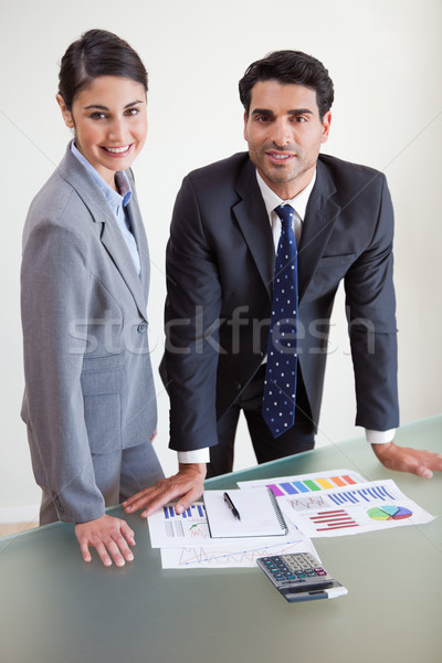 Portrait of smiling sales persons studying their results in an office Stock photo © wavebreak_media