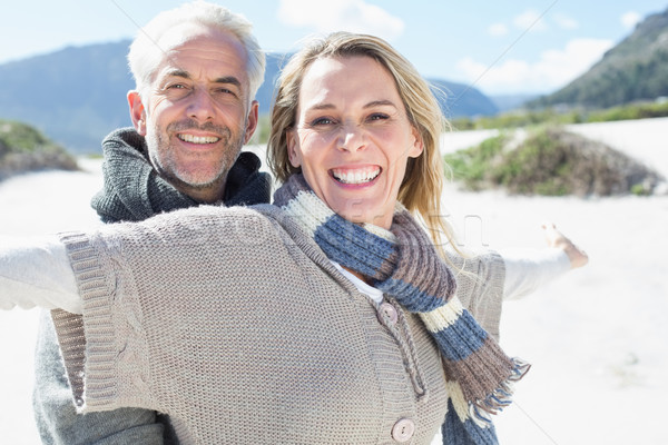 [[stock_photo]]: Insouciance · couple · permanent · plage · vêtements · chauds · lumineuses